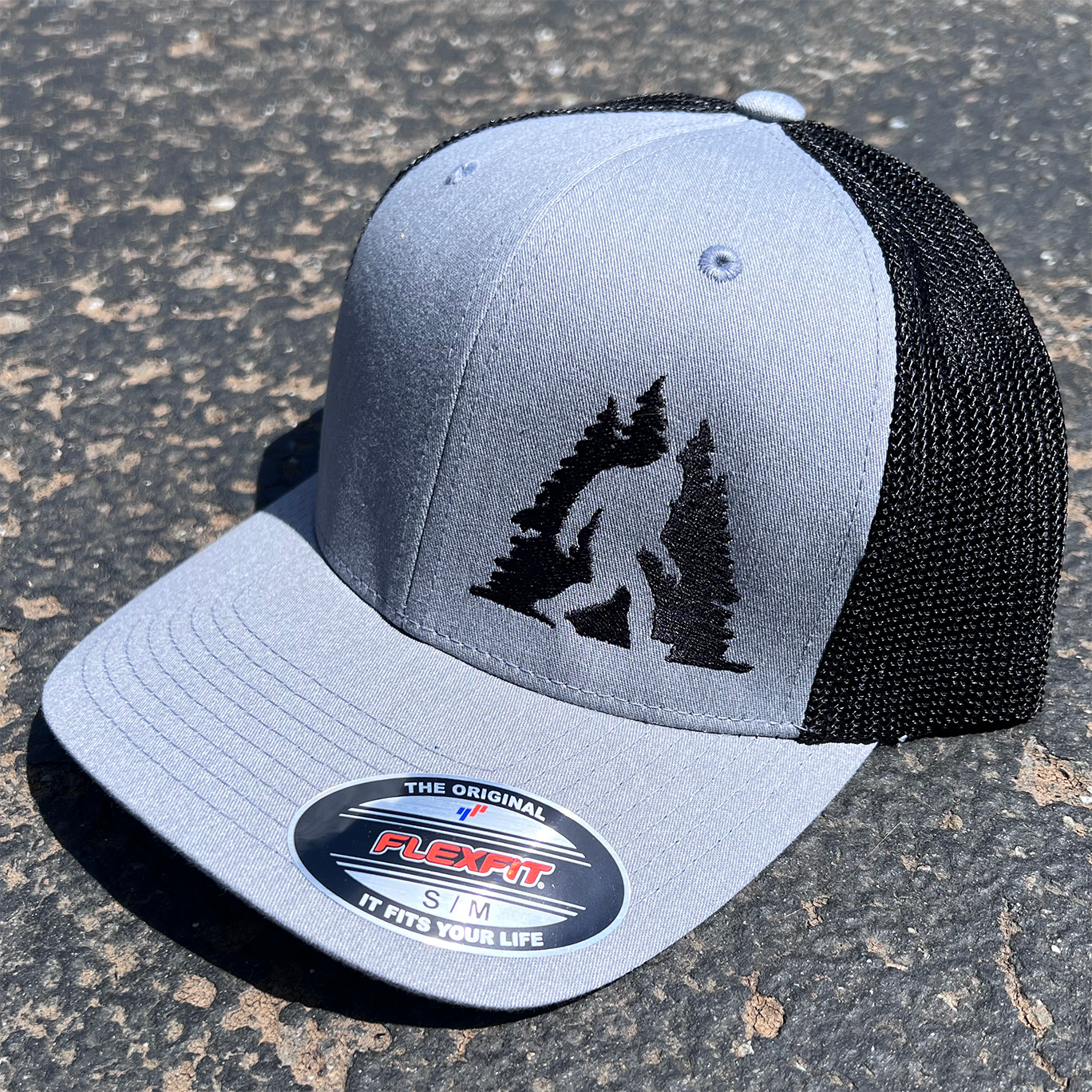 Sasquatch in Trees Curved Bill Trucker